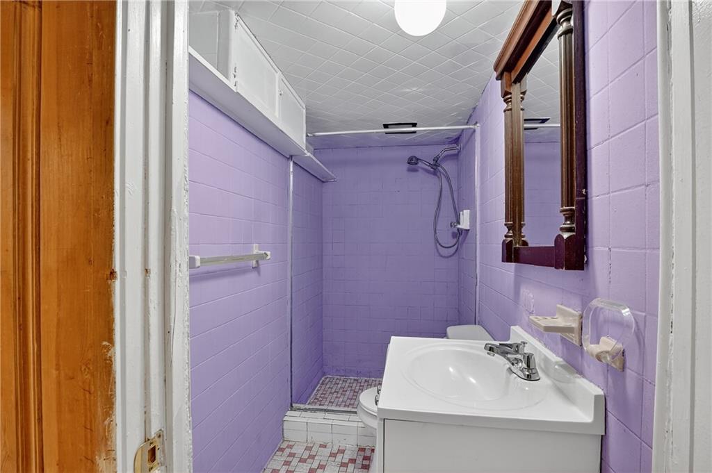1209 Varner Road Pittsburgh, PA 15227 - Photo 29 of 40 a bathroom with a sink a toilet and shower curtain