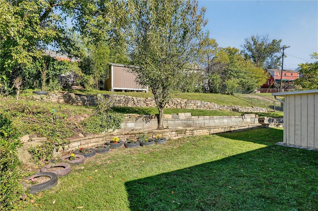 1209 Varner Road Pittsburgh, PA 15227 - Photo 39 of 40 a view of a garden with a bench