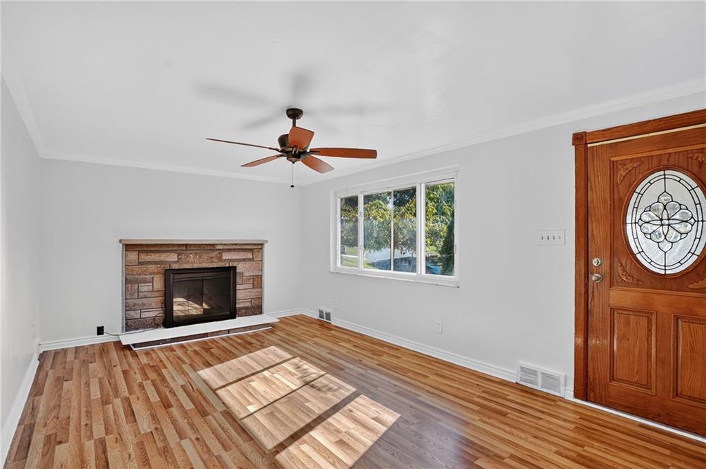 1209 Varner Road Pittsburgh, PA 15227 - Photo 5 of 40 a view of an empty room with window and wooden floor