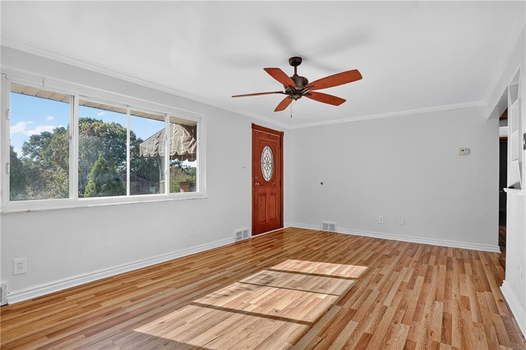 1209 Varner Road Pittsburgh, PA 15227 - Photo 6 of 40 a view of empty room with wooden floor and fan
