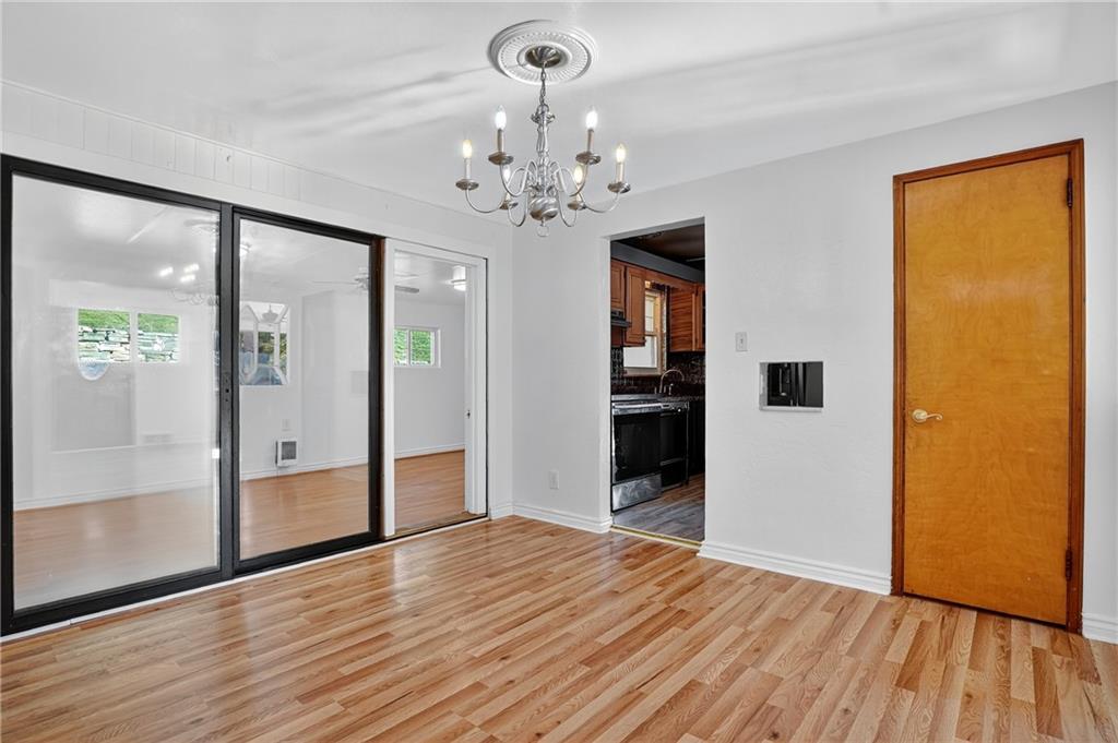 1209 Varner Road Pittsburgh, PA 15227 - Photo 8 of 40 a view of a room with wooden floor and door
