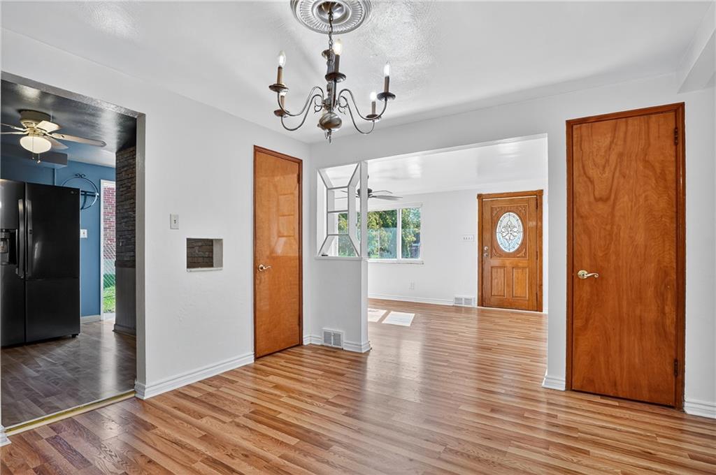 1209 Varner Road Pittsburgh, PA 15227 - Photo 9 of 40 a view of livingroom with window and wooden floor