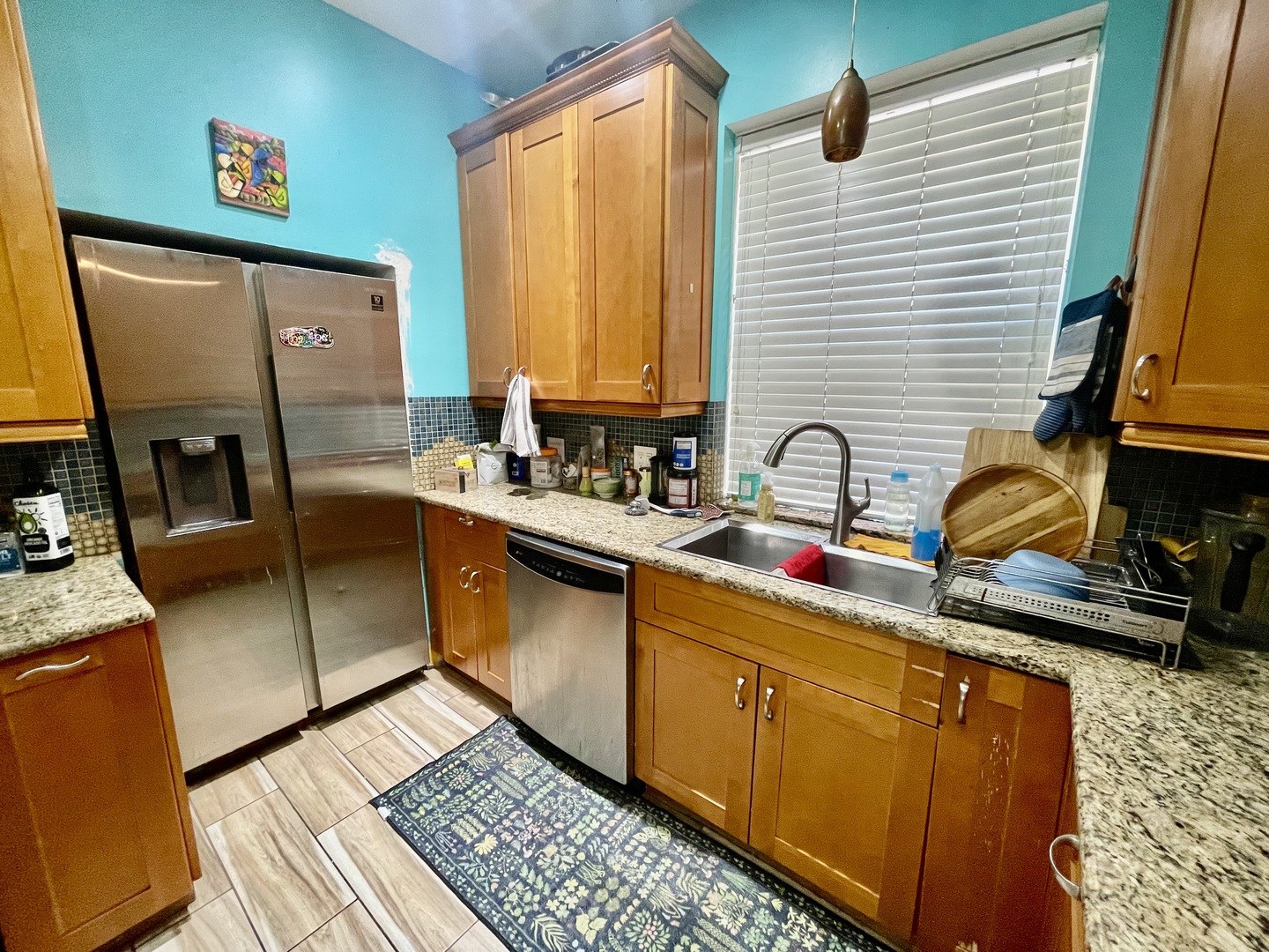 7916 South Constance Avenue Chicago, IL 60617 - Photo 14 of 28 a kitchen with stainless steel appliances granite countertop a sink stove and cabinets