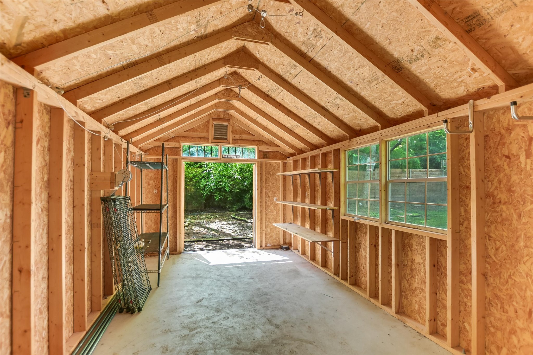 208 Braeswood Road Austin, TX 78704 - Photo 19 of 20 A versatile outbuilding with ample natural light, ready for storage or a workshop.