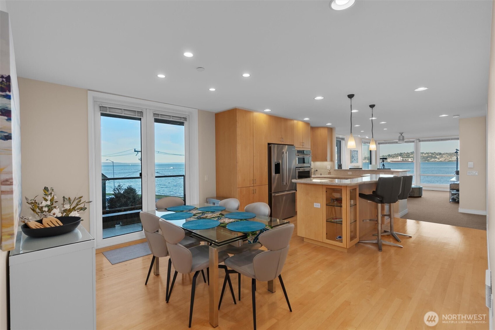 1005 Harbor Avenue Southwest, Unit 400 Seattle, WA 98116 - Photo 10 of 39 a dining room with furniture and wooden floor