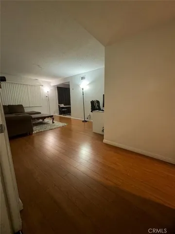 a view of a livingroom with furniture and wooden floor