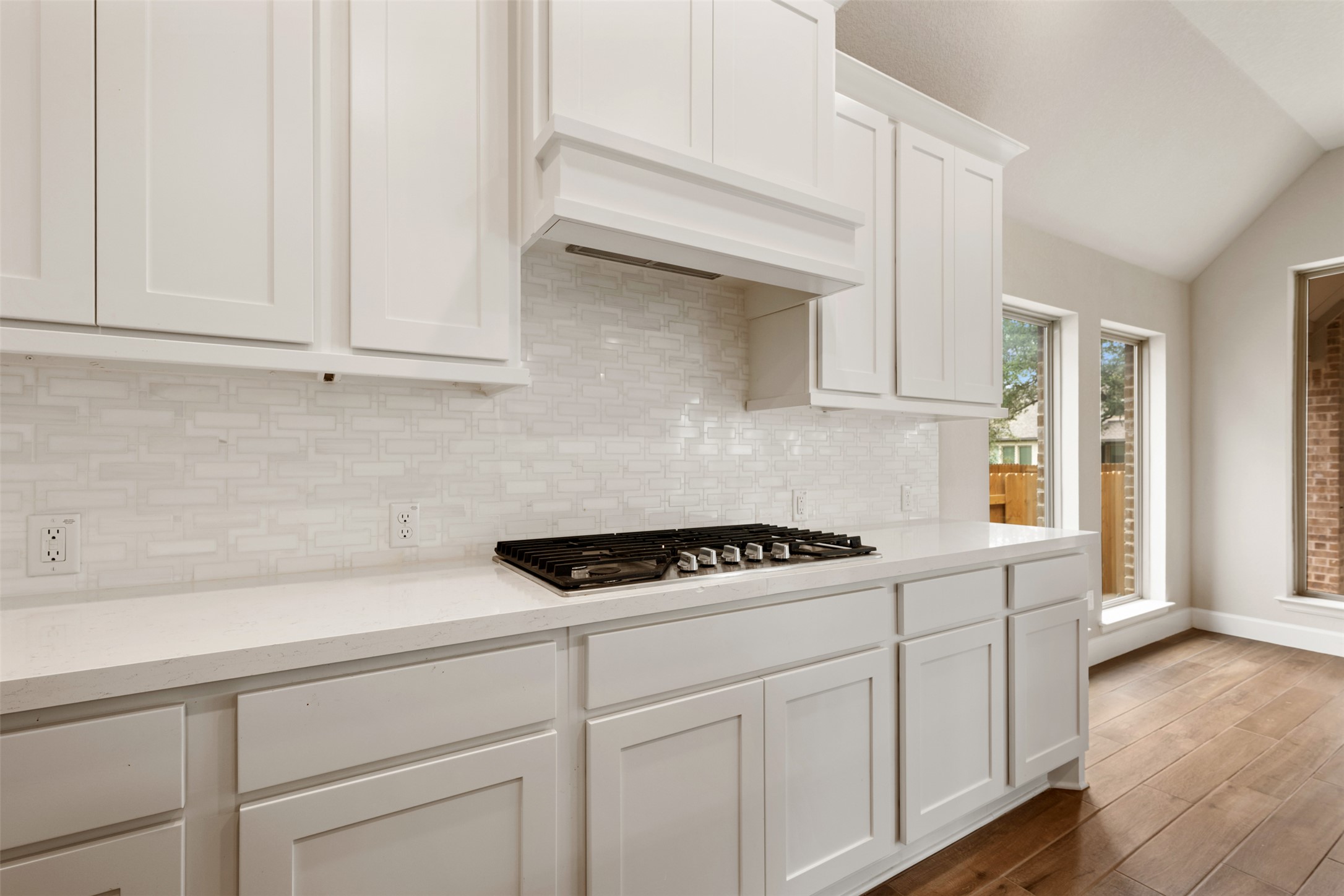 104 Anejo Bluff Georgetown, TX 78628 - Photo 10 of 40 a kitchen with white cabinets and white appliances
