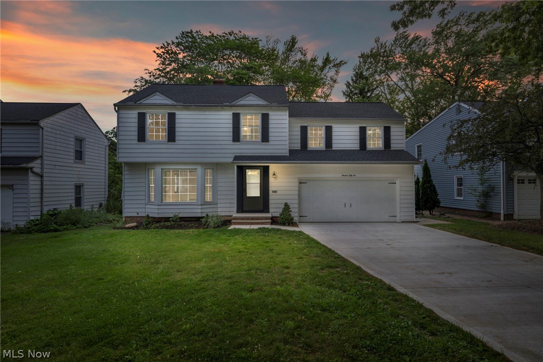 View of front of property with a yard