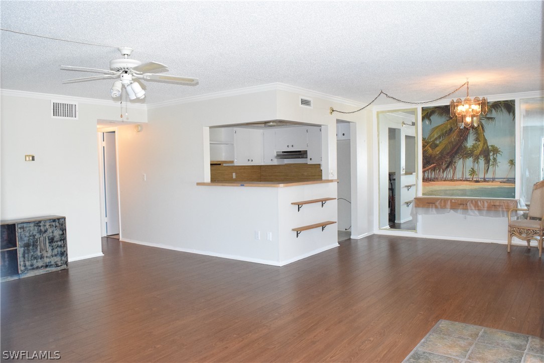 6777 Winkler Road, Unit 174 Fort Myers, FL 33919 - Photo 3 of 19 a view interior of a house wooden floor and an entryway