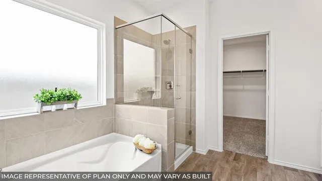 a en suite bathroom with a double vanity sink and a mirror