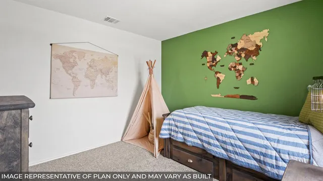 a bedroom with two beds and a window