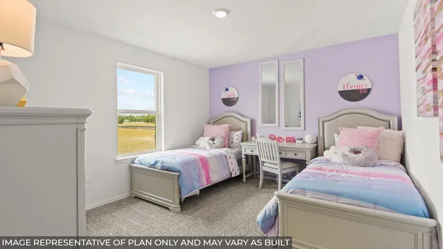 a bedroom with bed and cupboard