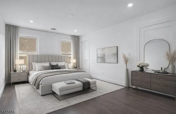 a bedroom with a bed and a dresser