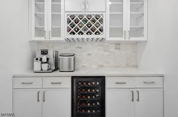 a kitchen with a white cabinets and a stove