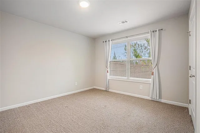 a view of room with window and hardwood floor