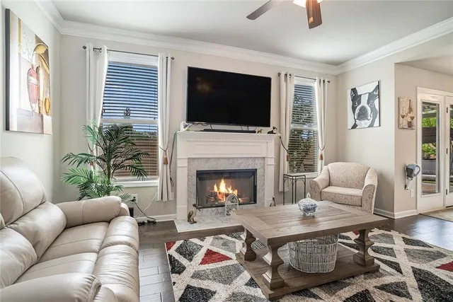 a living room with furniture fireplace and flat screen tv