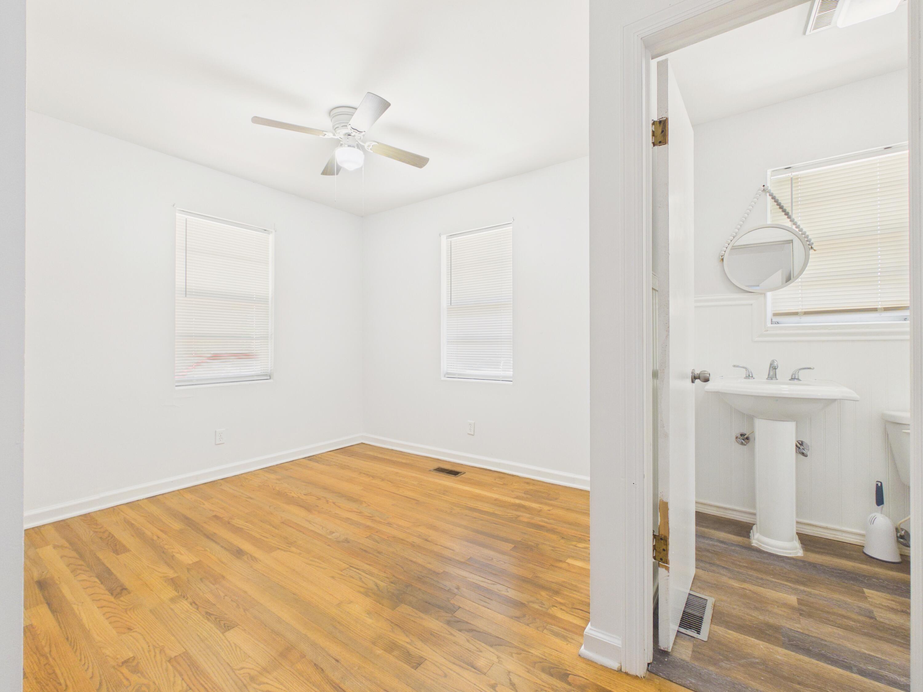 800 Old Whiskey Road South New Ellenton, SC 29809 - Photo 14 of 31 a view of a room with wooden floor and a ceiling fan