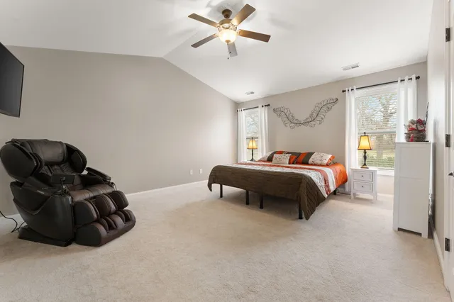 a bedroom with a bed and window