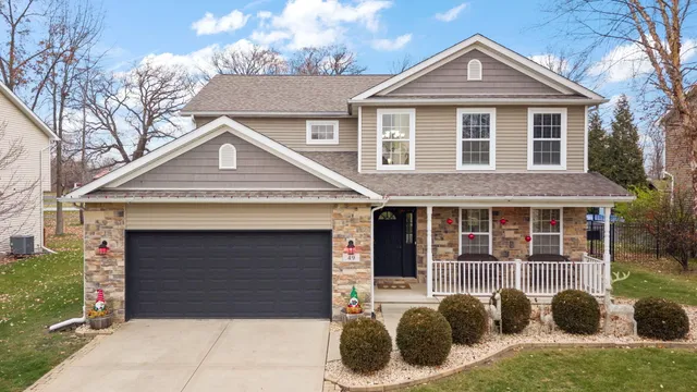 a front view of a house with a garage