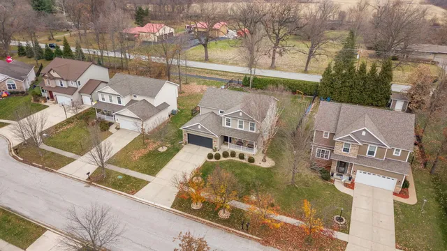 an aerial view of a house with swimming pool and outdoor space