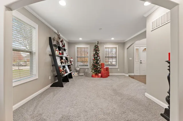 a view of a room with gym equipment and a large window