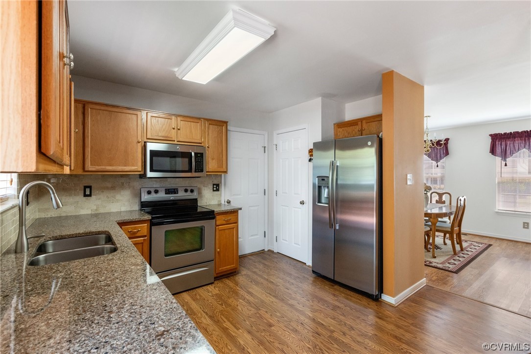 6708 Gills Gate Court Chesterfield, VA 23832 - Photo 13 of 34 a kitchen with stainless steel appliances granite countertop a refrigerator stove and sink