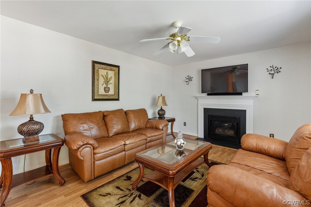 6708 Gills Gate Court Chesterfield, VA 23832 - Photo 16 of 34 a living room with furniture a fireplace and a flat screen tv