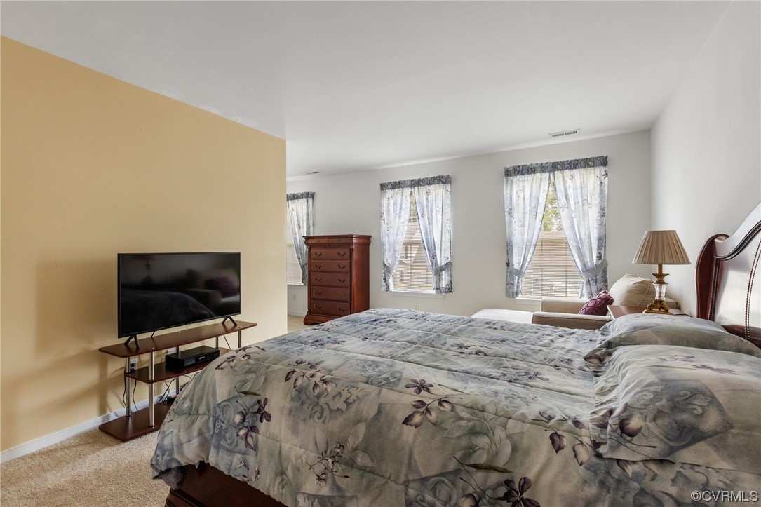 6708 Gills Gate Court Chesterfield, VA 23832 - Photo 20 of 34 a bedroom with a bed and a flat screen tv