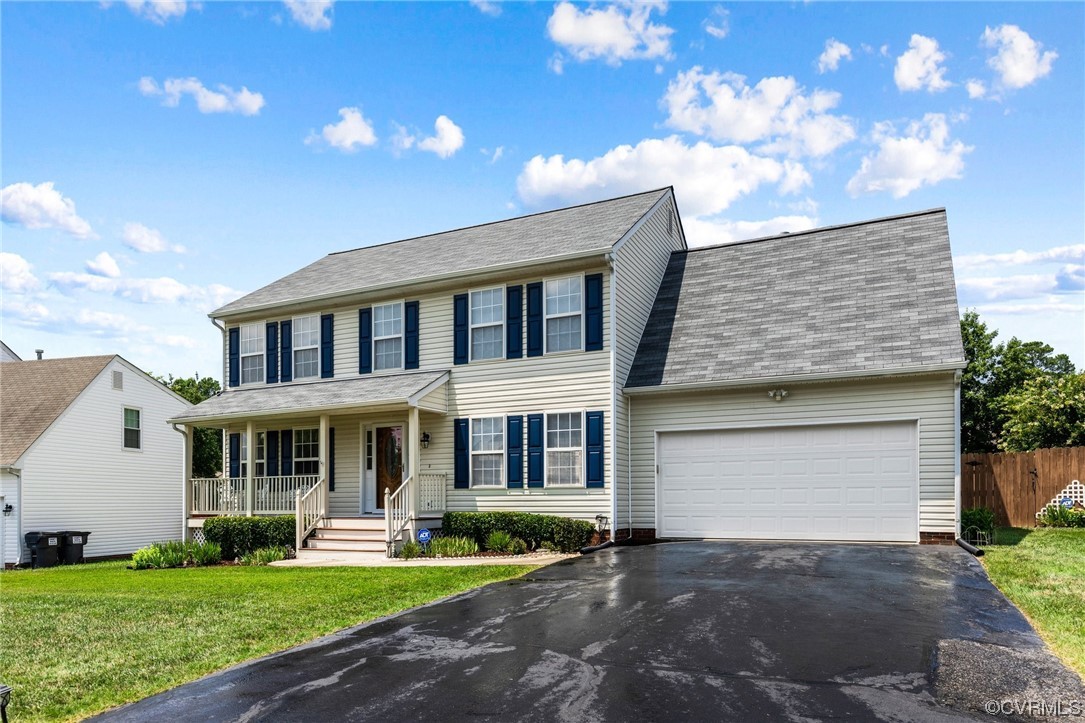 6708 Gills Gate Court Chesterfield, VA 23832 - Photo 2 of 34 a front view of a house with a yard and garage