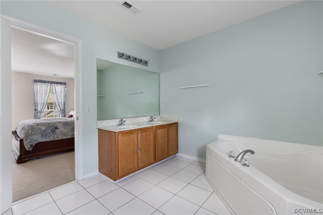 6708 Gills Gate Court Chesterfield, VA 23832 - Photo 22 of 34 a bathroom with a tub a sink and mirror