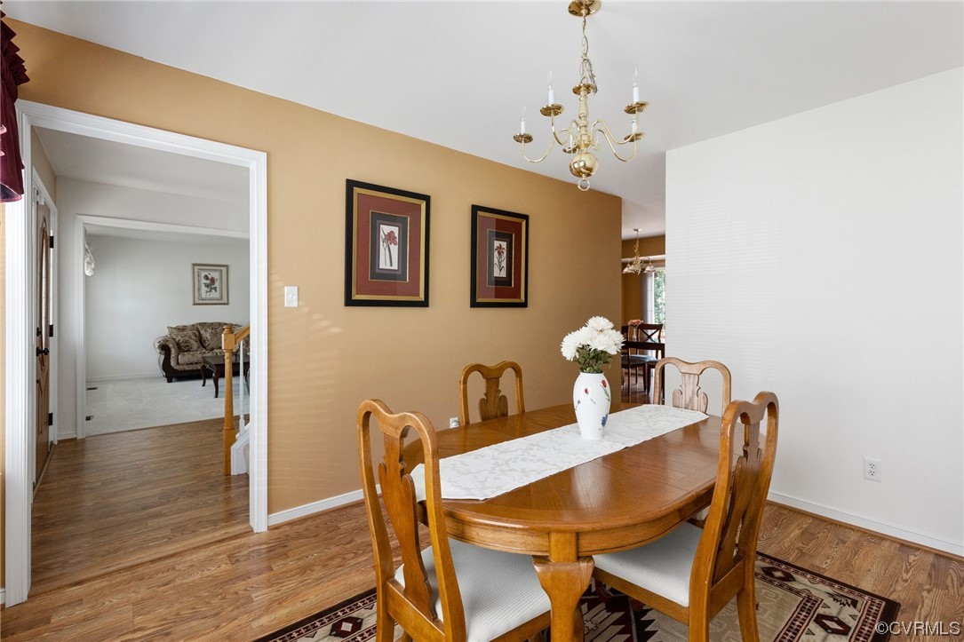 6708 Gills Gate Court Chesterfield, VA 23832 - Photo 8 of 34 a dining room with furniture and wooden floor