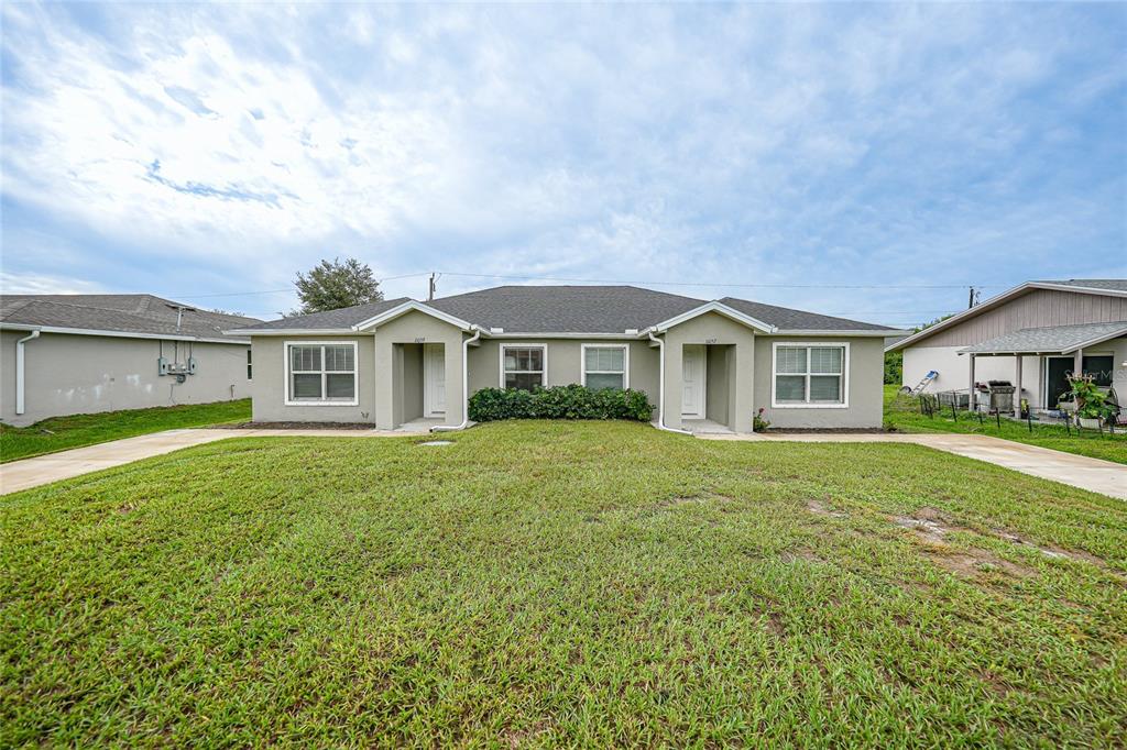 a front view of house with yard and green space