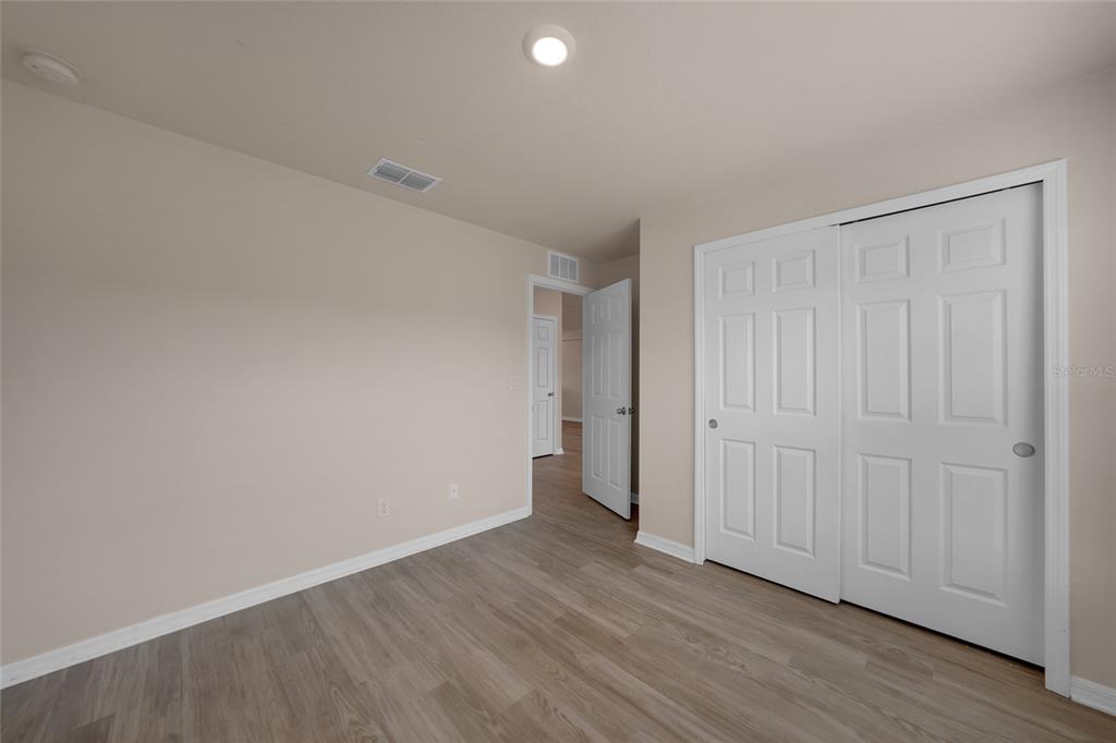 11057 Pendleton Avenue Englewood, FL 34224 - Photo 15 of 37 a view of an empty room with wooden floor