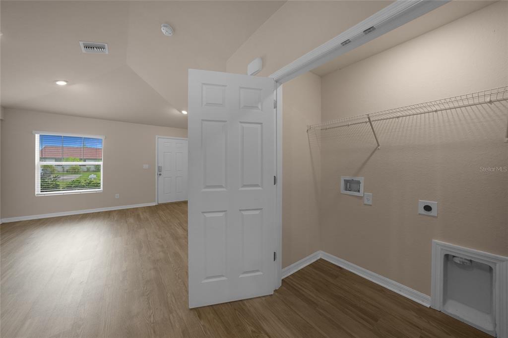 11057 Pendleton Avenue Englewood, FL 34224 - Photo 16 of 37 a view of room with hardwood floor and window
