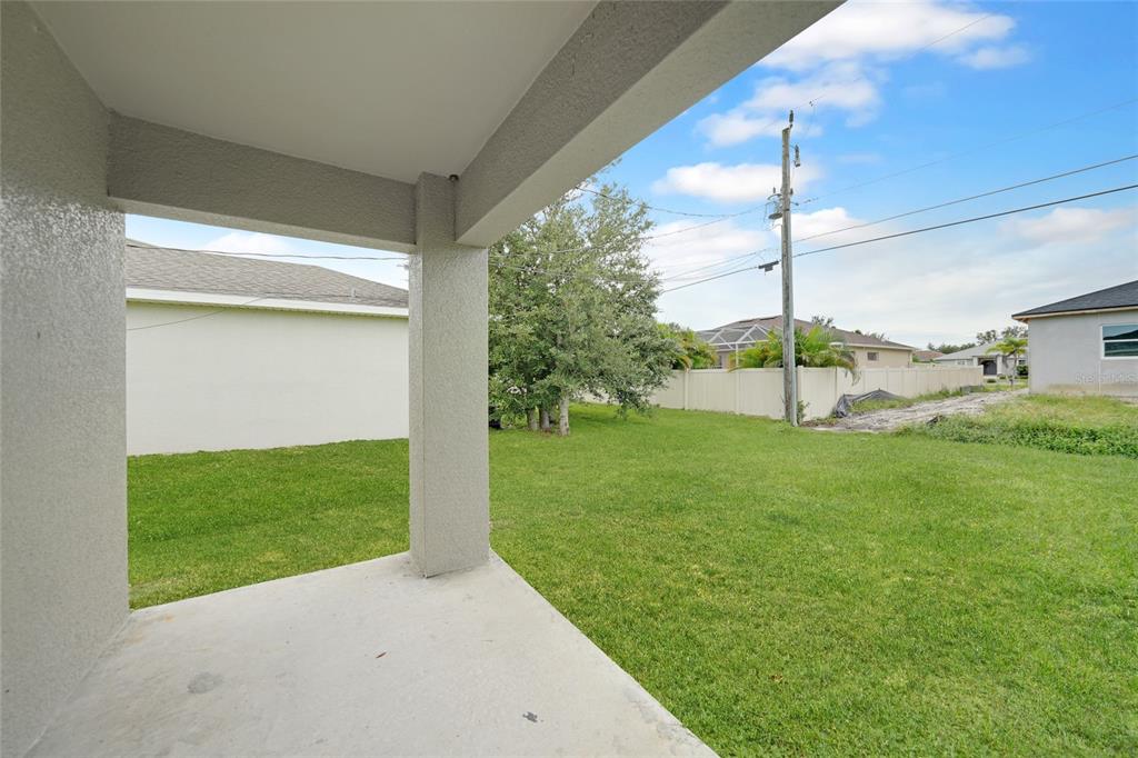 11057 Pendleton Avenue Englewood, FL 34224 - Photo 20 of 37 a view of a porch with a big yard