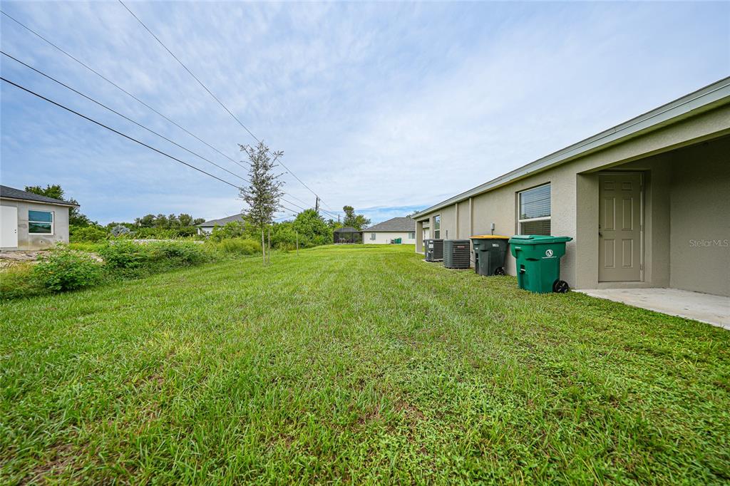 11057 Pendleton Avenue Englewood, FL 34224 - Photo 22 of 37 a house view with a garden space