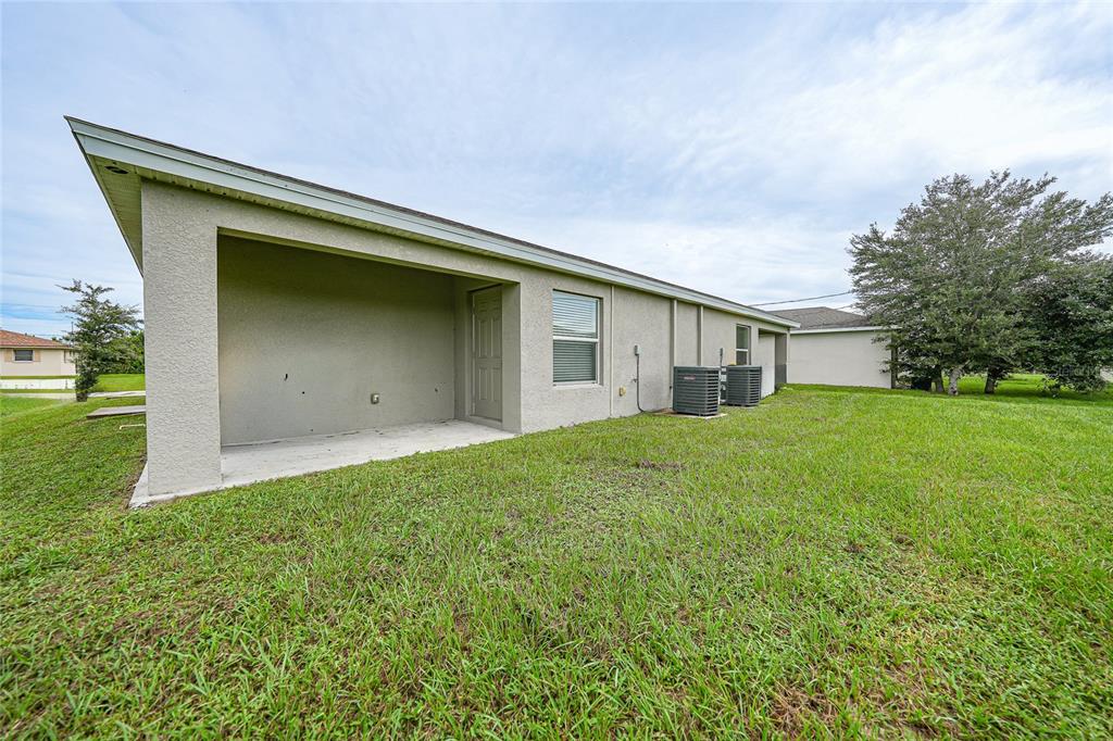 11057 Pendleton Avenue Englewood, FL 34224 - Photo 24 of 37 a house view with a backyard space
