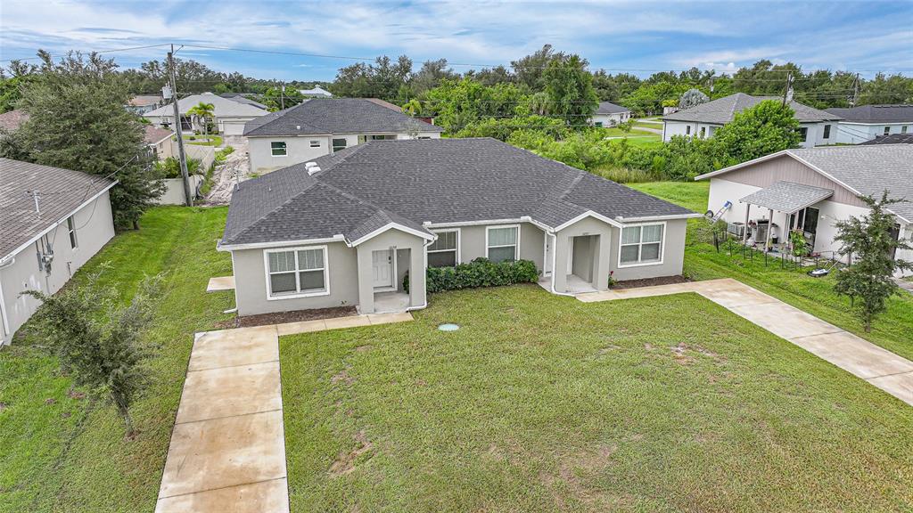 11057 Pendleton Avenue Englewood, FL 34224 - Photo 26 of 37 an aerial view of a house with a yard