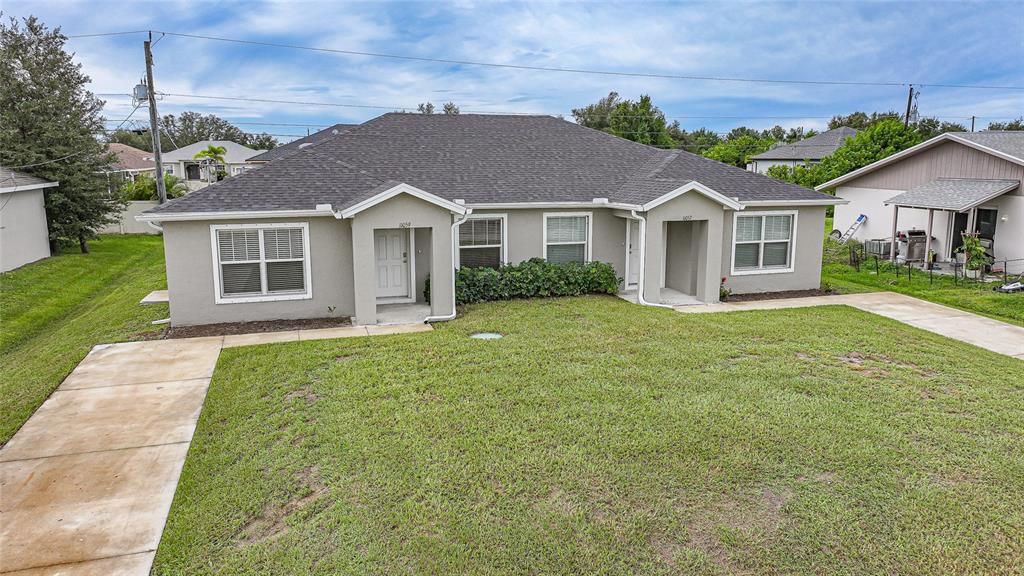 11057 Pendleton Avenue Englewood, FL 34224 - Photo 28 of 37 front view of a house and a yard
