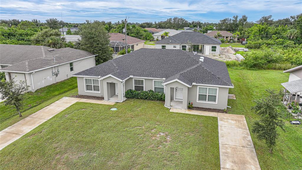11057 Pendleton Avenue Englewood, FL 34224 - Photo 30 of 37 an aerial view of residential houses with outdoor space and trees