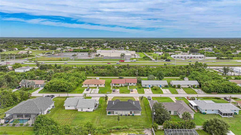 11057 Pendleton Avenue Englewood, FL 34224 - Photo 36 of 37 an aerial view of residential houses with outdoor space and trees