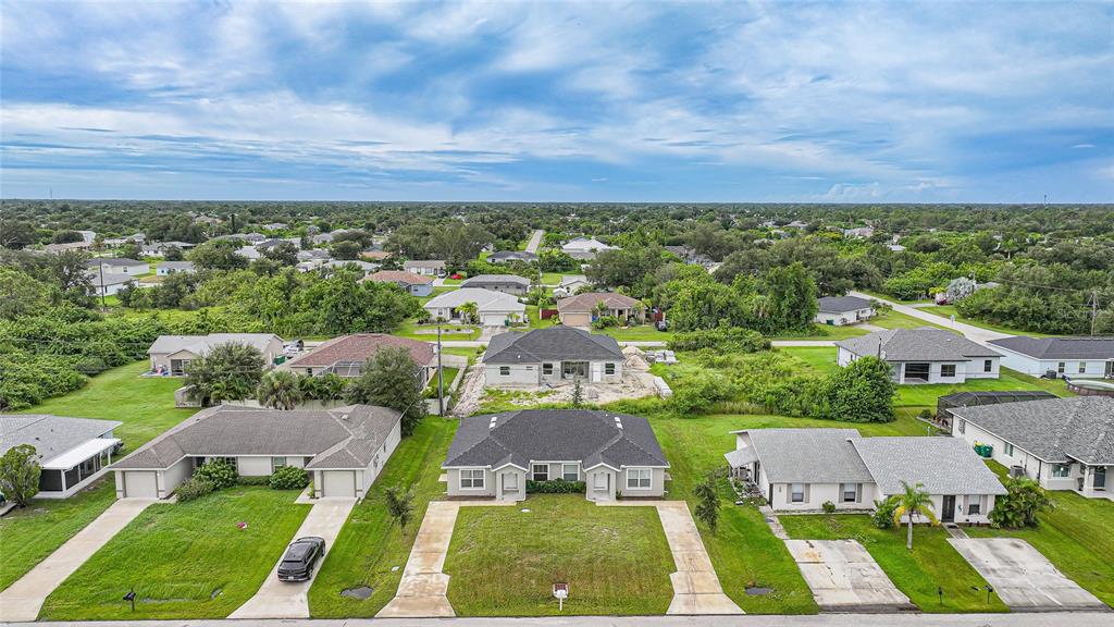 11057 Pendleton Avenue Englewood, FL 34224 - Photo 37 of 37 a view of a city with lots of car parked on the street side