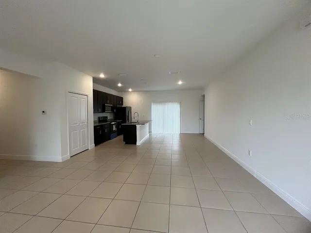 a view of kitchen appliances with cabinets