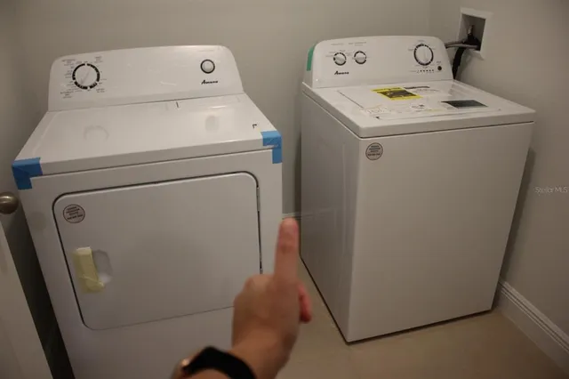 a view of a room with a large window