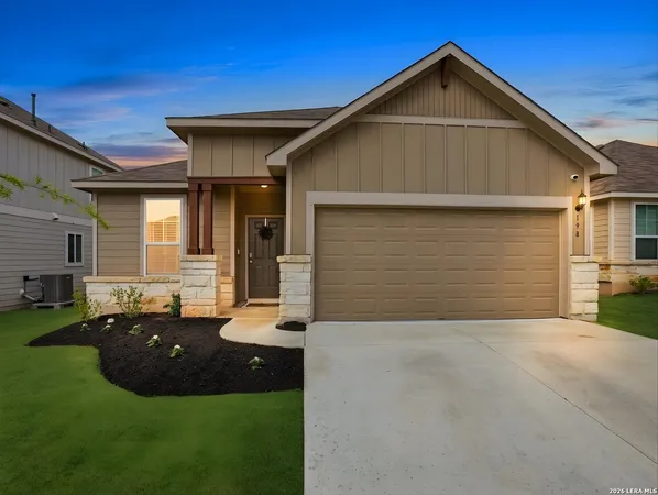 a front view of a house with yard