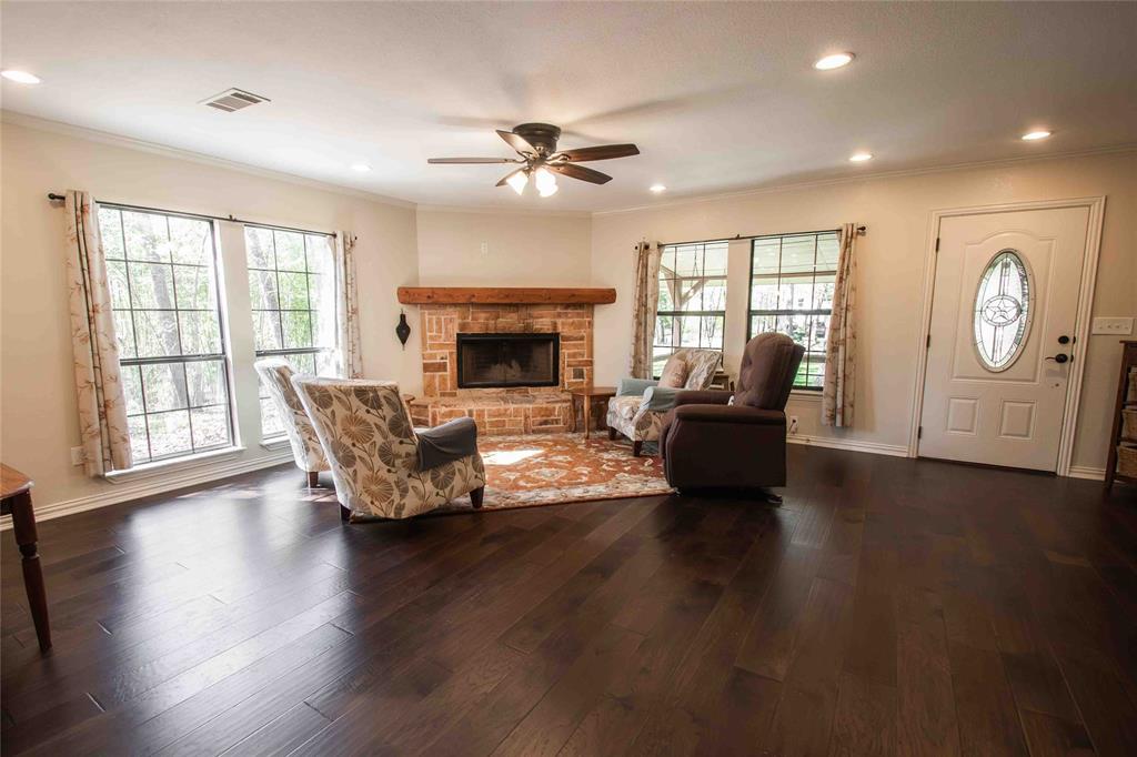 1024 Summit Ridge Murchison, TX 75778 - Photo 13 of 35 Wood burning fireplace in open concept living room