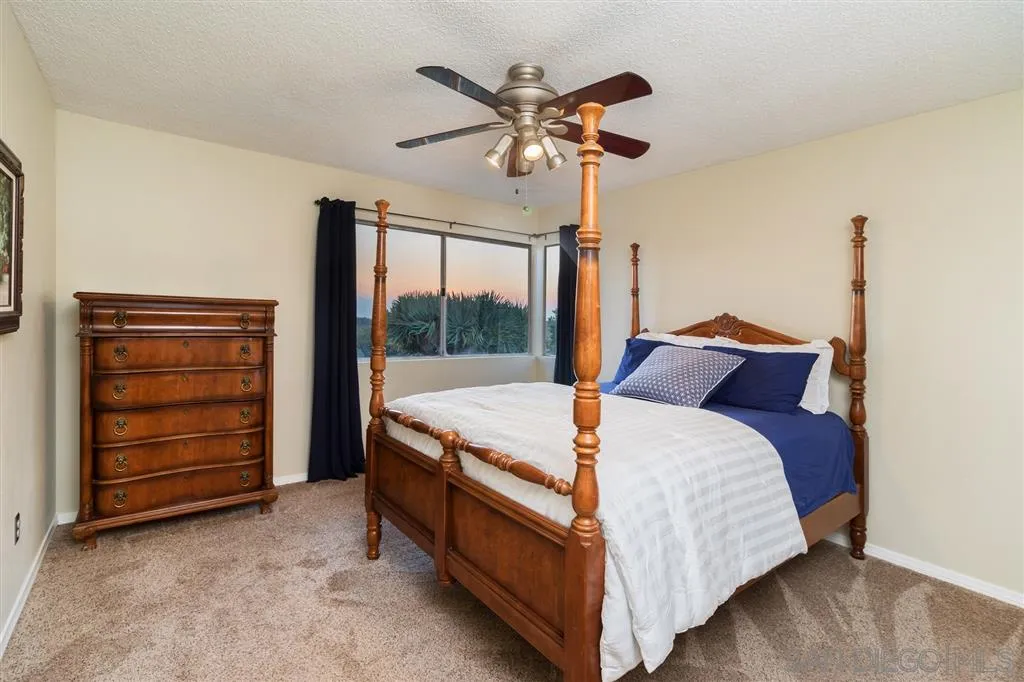 13524 Ridley Road San Diego, CA 92129 - Photo 17 of 23 a bed room with a bed and a ceiling fan