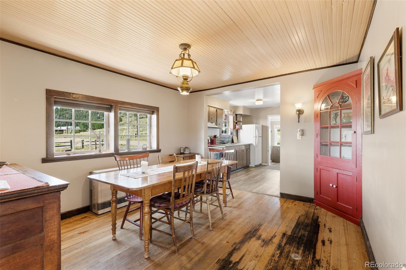 154 Mariposa Street Hartsel, CO 80449 - Photo 12 of 48 a view of a dining room with furniture window and wooden floor