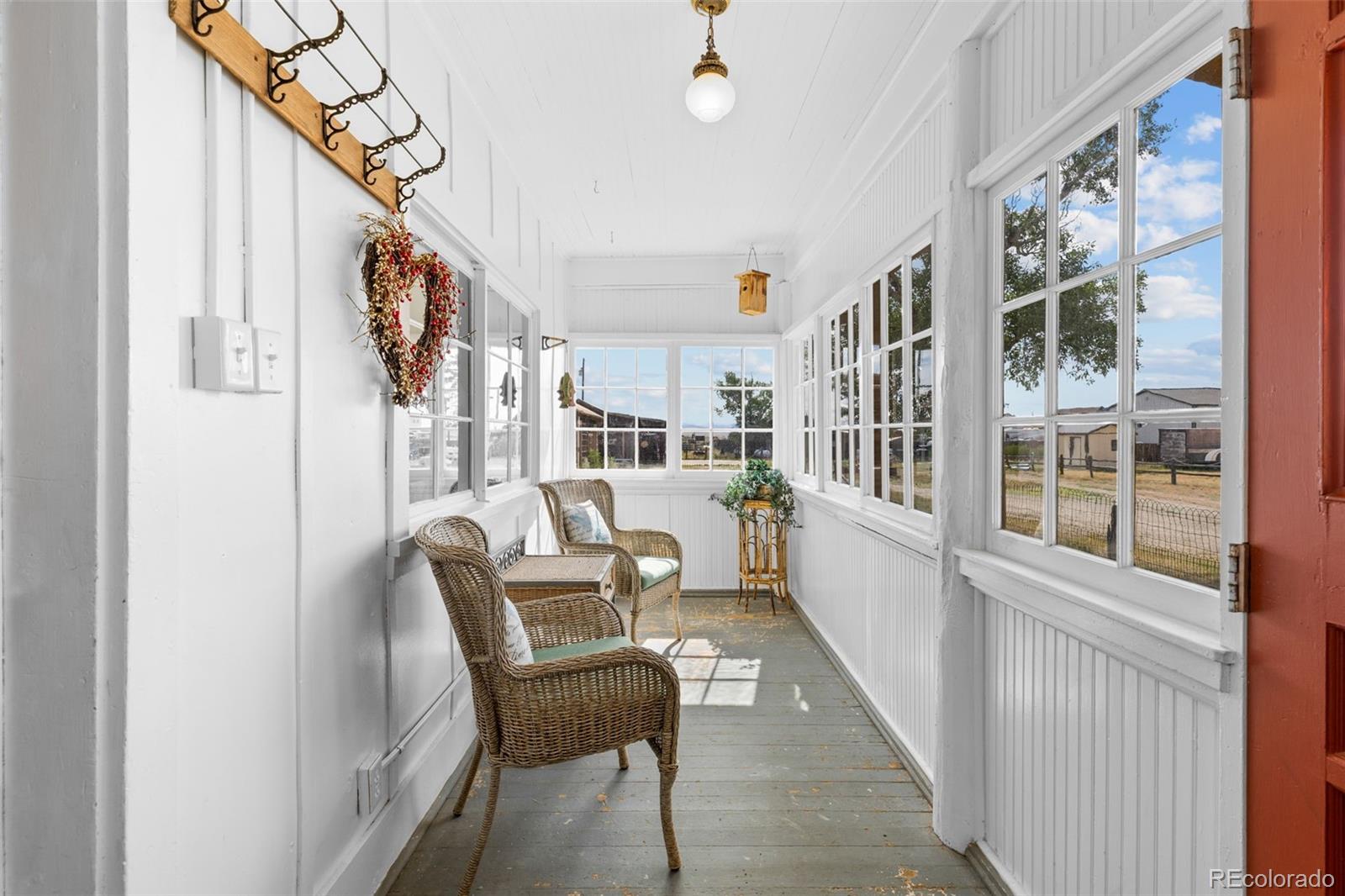 154 Mariposa Street Hartsel, CO 80449 - Photo 4 of 48 a dining room with wooden floor and furniture