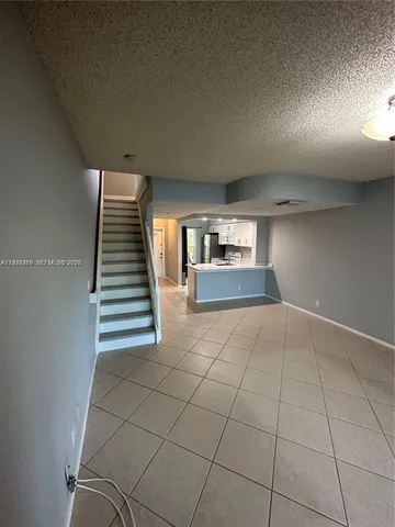 wooden floor in an empty room with a fireplace